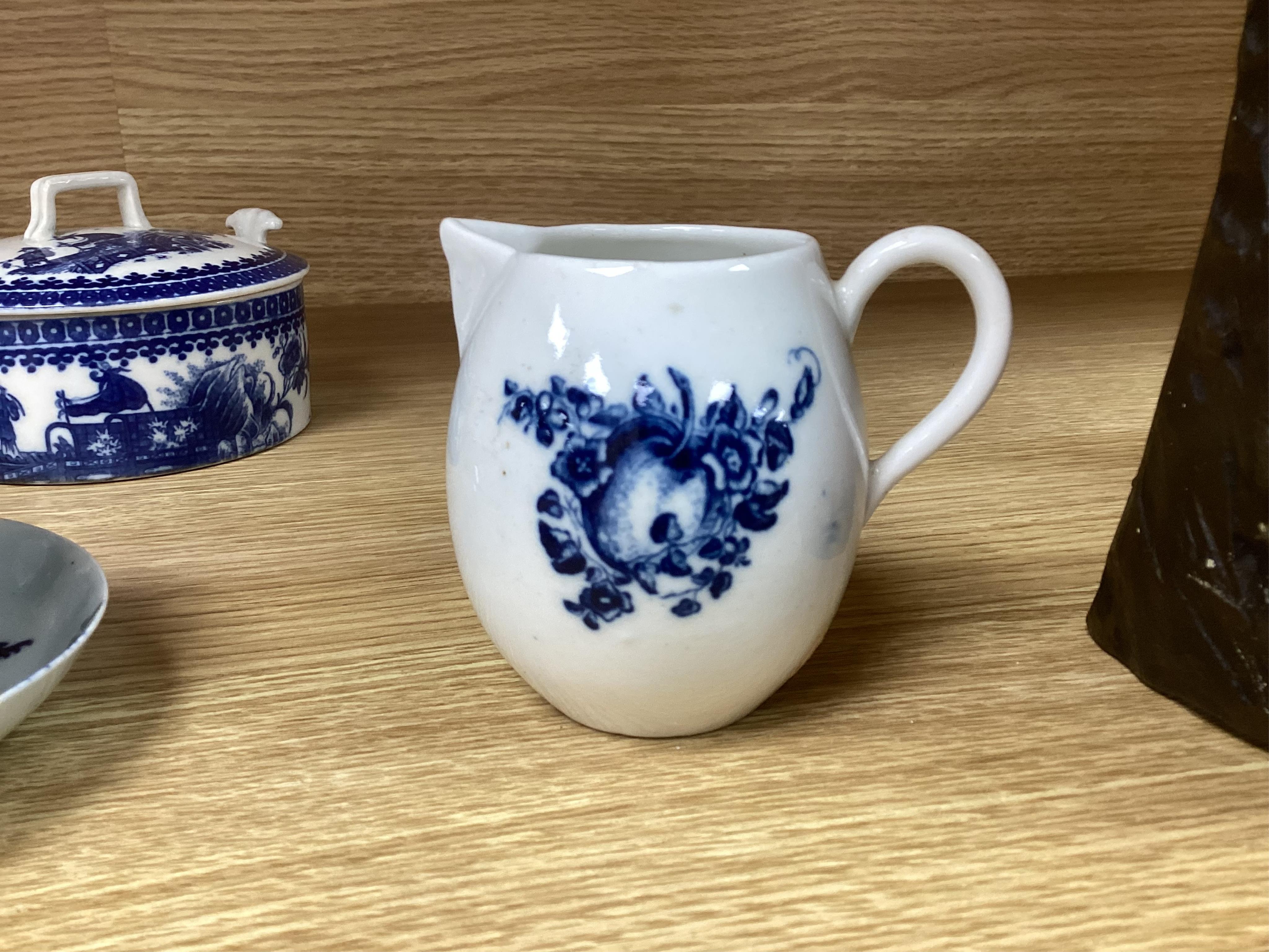 A group of 18th century Worcester and Liverpool porcelain teaware and a Caughley Cormorant fisherman butter tub and cover.